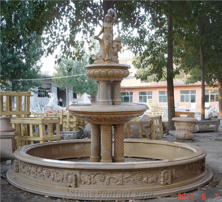 sculptured yellow limestone rolling sphere garden fountain