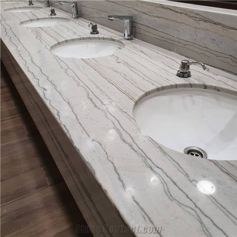 White Macaubas Quartzite In A Commercial Bathroom