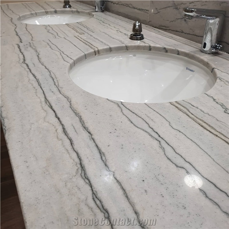 White Macaubas Quartzite In A Commercial Bathroom