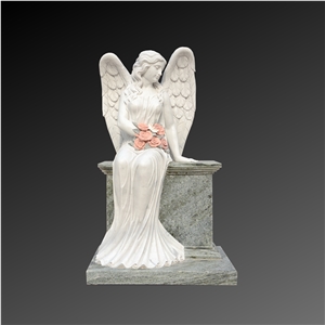 Angel Carving Sitting On Headstone In White And Green Marble