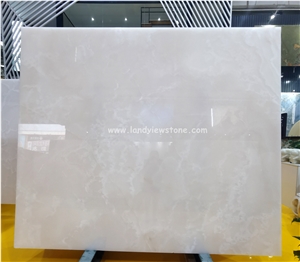 Backlit Snow White Onyx Slabs