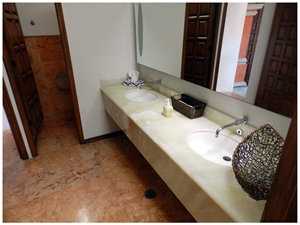Baja Onyx Bathroomm Countertop and Ticul Naranja Limestone Flooring