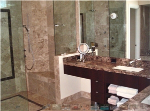 Polished Cappuccino marble master bathroom with dark Emperaor marble features