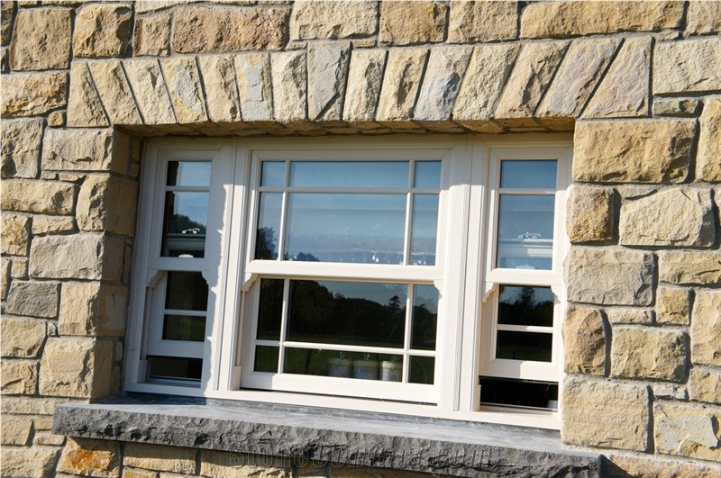 Donegal Sandstone with Brush Hammered Sandstone Window and Door Surrounds