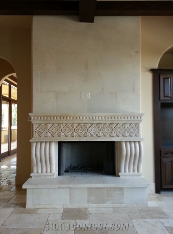 Riviera Beige Cantera Carved Fireplace