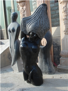 Abstract Statue by Black Limestone