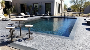 Blue Stone Coping and Black Pebble Tile Swimming Pool Pavement
