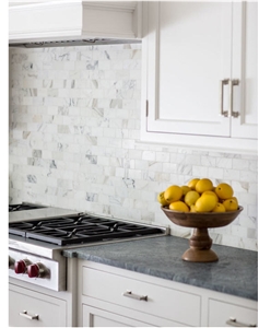 Perimeter is Classic Soapstone Counter and Calacatta Gold Marble Island Top