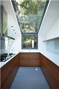 Kitchen with Corian Countertop, Orvieto Basalt Stone Flooring