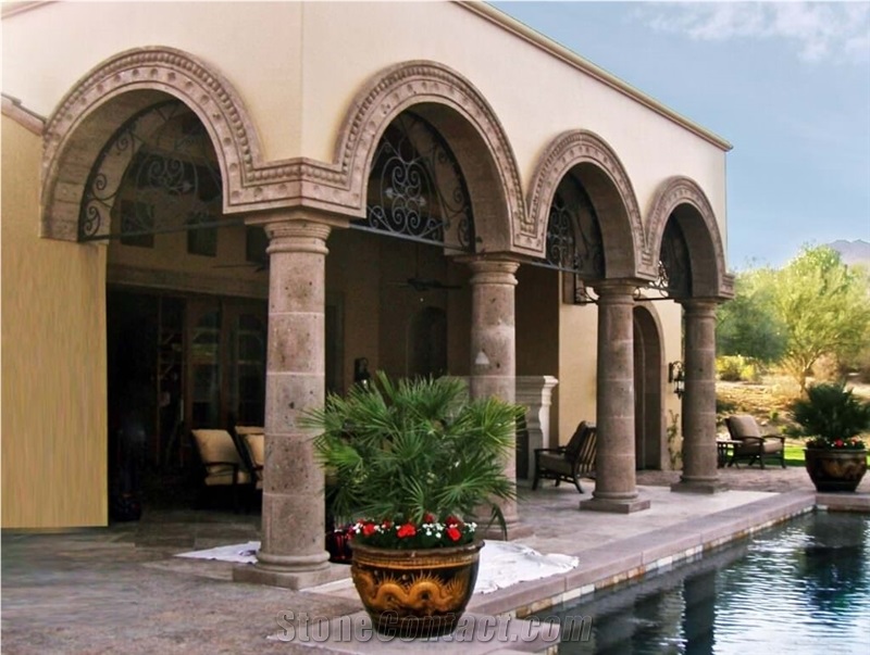 Tuscan Columns with Tapered Smooth Shafts with Arched Radius Moulding Surrounds in Cafe Cantera Stone