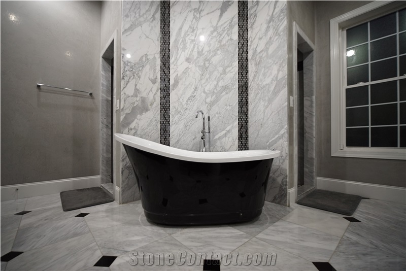 Bathroom Accent Wall Using Super White Quartzite to Tie the Countertops and Room Together