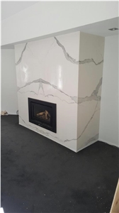Statuario White Marble Look in Vein Link as the Feature Fireplace