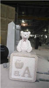 Yellow Beige Monument with Bear Carving