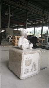 Yellow Beige Monument with Bear Carving