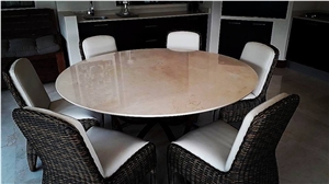 A Large Crema Marfil Circular Table Made from One Solid Slab