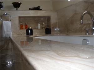 Pale Marble Bathroom with Recess Behind Bath