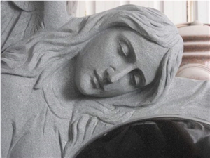 Angel Roses Underneath Black Granite Headstone