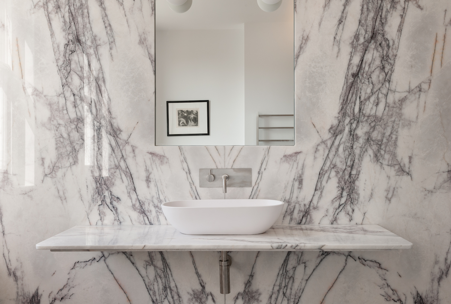 white-slab-marble-wall-in-bathroom.jpg