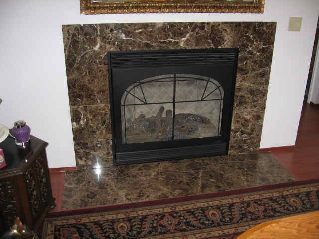 dark emperador marble fireplace.jpg