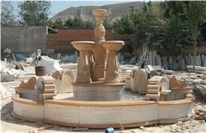 sculptured yellow limestone rolling sphere garden fountain
