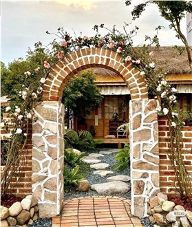 TAITONE tumbled yellow firebrick in vintage garden wall