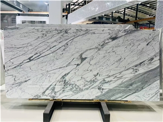 Bianco Statuario Marble Slabs Revealing Wavy Gray Streaks